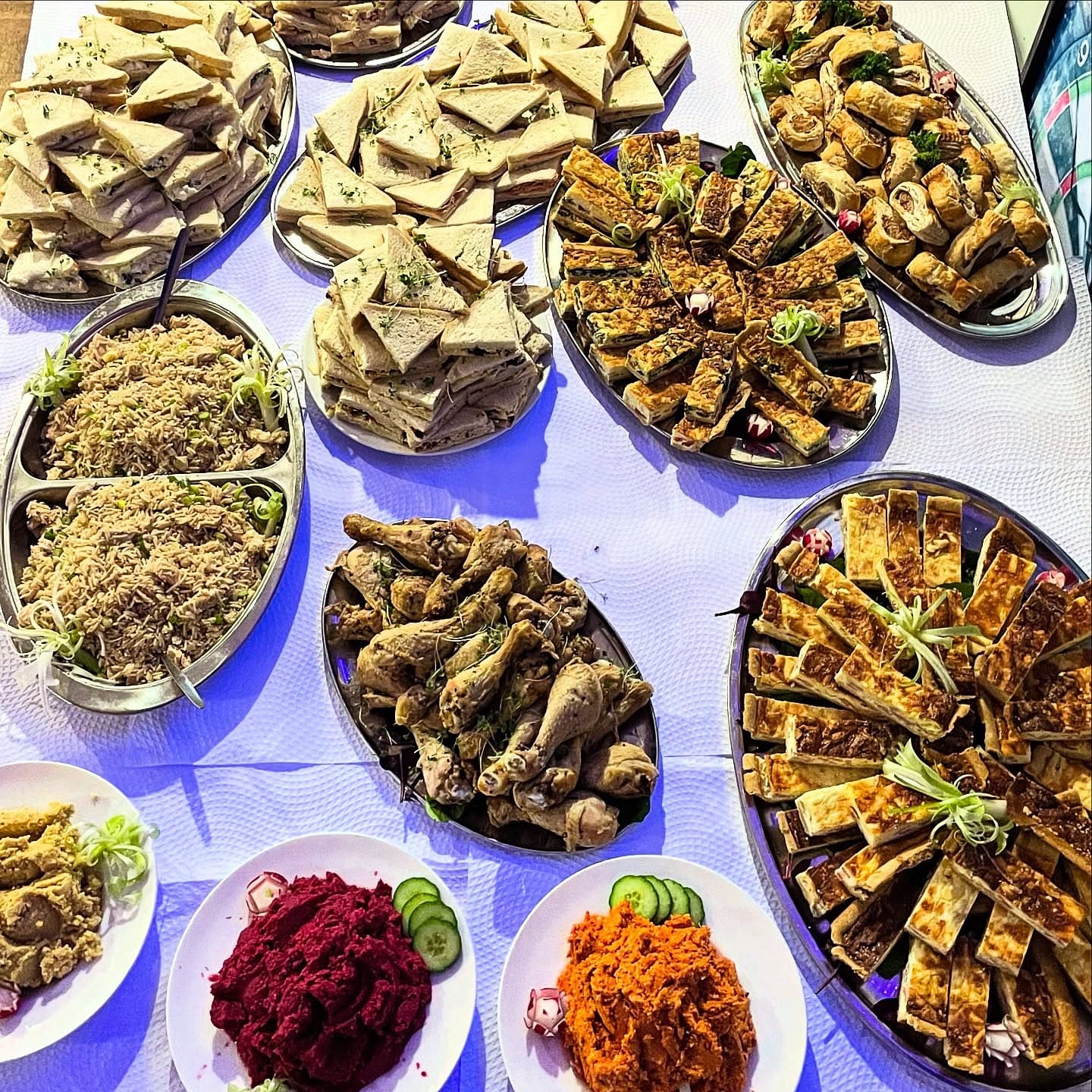 Buffet platters set out for a private event at MK